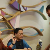 Trista Bergerud (left) and Long Ho (right) checking in a judge